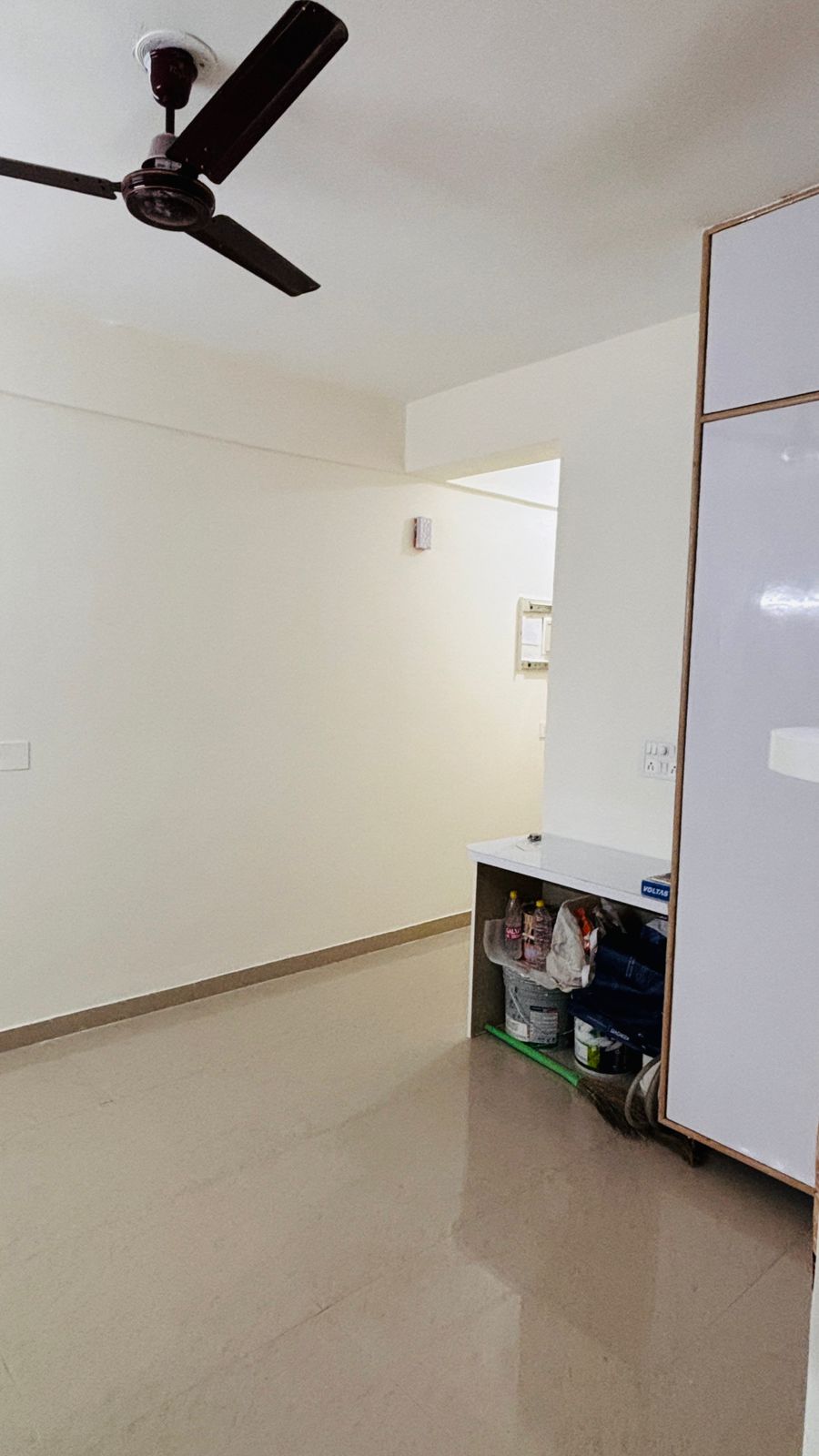 Empty room with minimal furniture.