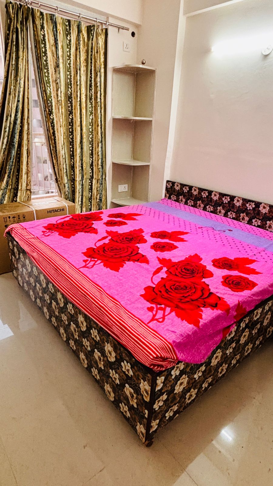 Colorful bed with floral blanket