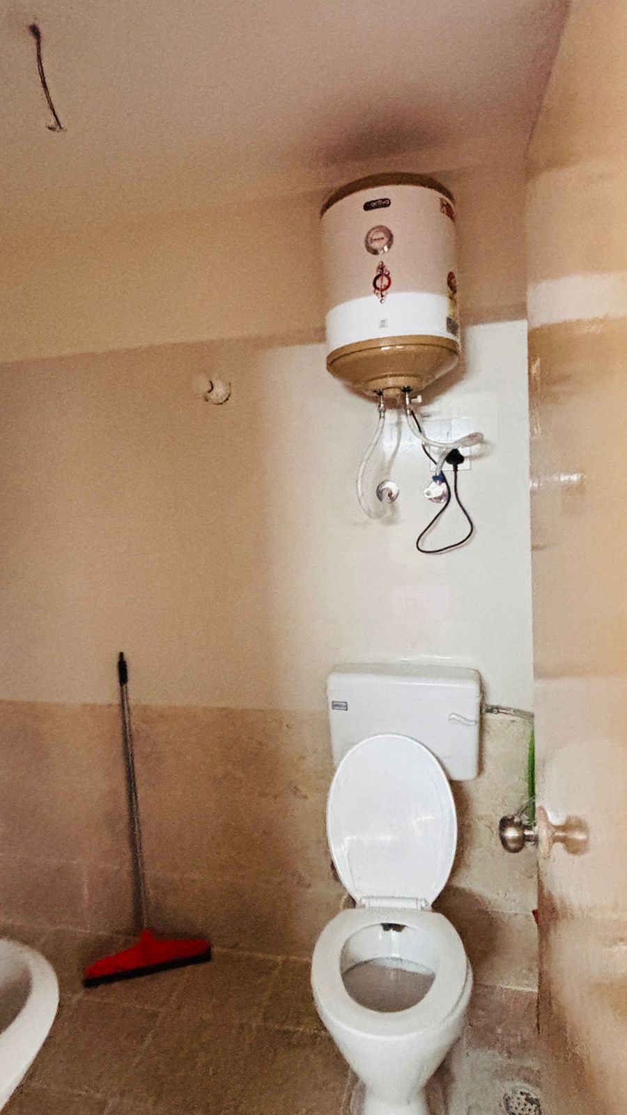 Bathroom with toilet and water heater